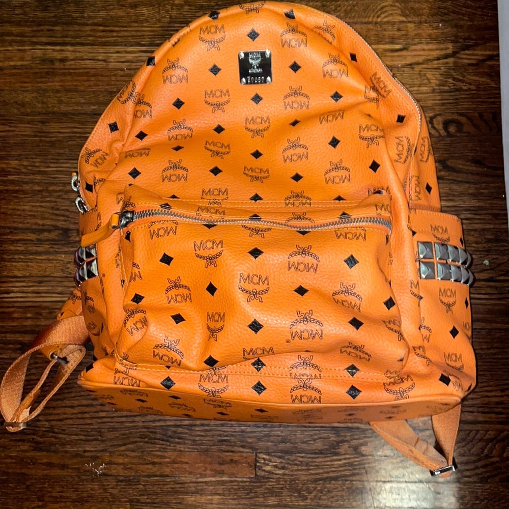 Orange silver studded mcm backpack